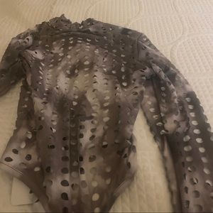 Grayish ombré sexy body suit   top  open areas reveal the skin. Must see